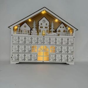 Detail of wooden 24-day advent calendar with LED lighted houses and numbered drawers