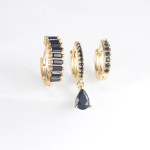 Three-piece gold plated earring set with drop-shaped black gemstones and square cut zircons