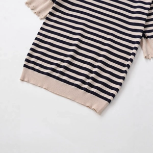 Striped knit top featuring ruffled cuffs and ribbed hem in navy and beige tones