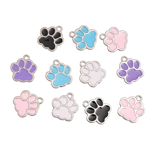 Macro detail of alloy paw-shaped charms with colorful drip oil finish for DIY jewelry