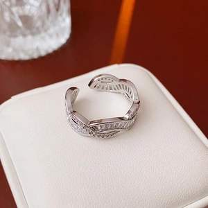 Elegant crossover open ring with heart-shaped oval crystals and silver finish