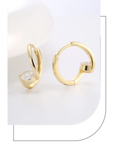 Detailed close-up of S925 sterling silver hoop earring with gold plating and cubic zirconia