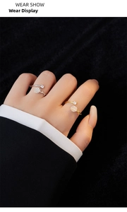 Close-up of elegant S925 silver camellia open ring with white resin flower and zircon