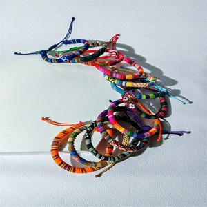 Detailed view of colorful handmade woven friendship bracelets with adjustable closures