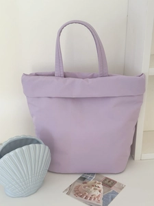 Detailed view of lavender fabric tote bag with premium stitching and minimalist design