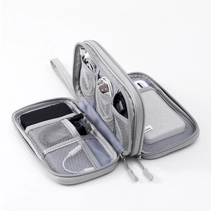 Internal view of grey electronics organizer bag with mesh pockets and elastic straps