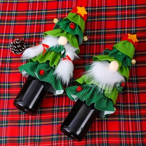 Christmas tree wine bottle covers with gnome design and stars for holiday table decor