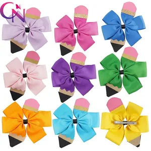 Detail view of colorful pencil-shaped hair clips made from grosgrain ribbon for school kids