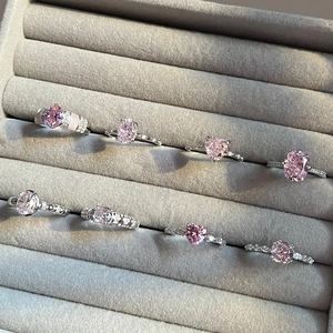 Elegant S925 sterling silver rings set with pink ice flower cut zircon stones in a velvet box