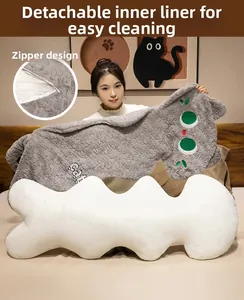 Detail view of the plush cat pillow showing the removable inner liner and zipper design