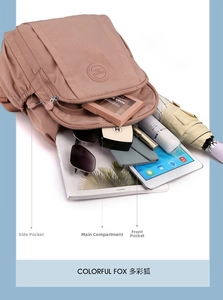 Internal view of a spacious pink nylon backpack showing multiple storage compartments