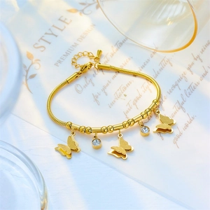 Close-up of rose gold butterfly bracelet with zirconia charms on a white card background