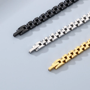 Detailed macro view showing black, silver, and gold stainless steel curved bar bracelets