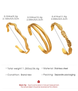Three-piece gold stainless steel cuff set featuring leaf pattern and wave designs
