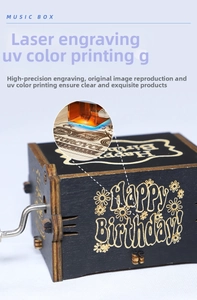 Detail of hand-cranked wooden music box with Happy Birthday laser engraving and motorcycle UV print