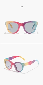Close-up of kids rainbow glitter round sunglasses with smoke grey lenses in C2 color style