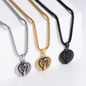 Detailed oval stainless steel cobra pendants in silver, gold, and black finishes