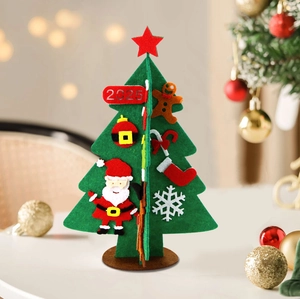 Detail of DIY felt mini Christmas tree 2025 with ornaments on a festive wooden base