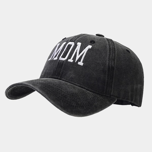 Close-up of white MOM embroidery on a vintage washed cotton dark grey baseball cap