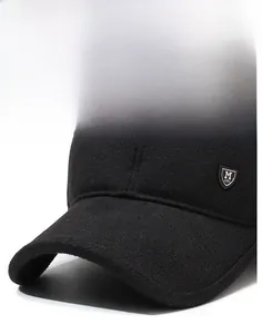Detail of a structured black winter baseball cap with a metal shield badge and curved brim
