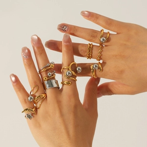 Modern two-tone gold and silver stainless steel rings set for women worn by model