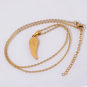 Golden 18K stainless steel wing pendant necklace with delicate chain on white background