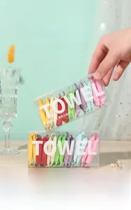 Travel kit with 14 compressed facial towels in colorful packaging and storage box