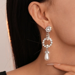 Elegant silver flower drop earrings with crystals and teardrop pearls for evening wear