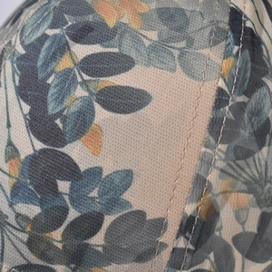 Close-up of the breathable mesh fabric with floral embroidery and high-quality stitching