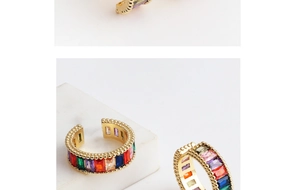 Detail of gold adjustable ring with multi-colored rectangular baguette-cut crystals