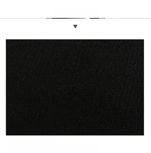 Detail shot of the soft black knit fabric and interior lining of the winter peaked cap