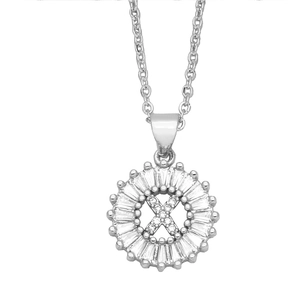 Macro shot of silver letter X pendant with sunburst baguette-cut cubic zirconia