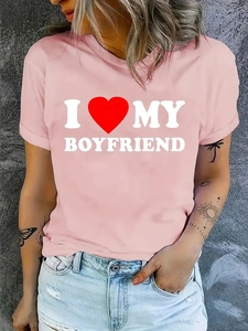 Pink short sleeve T-shirt with I Love My Boyfriend slogan print on a gray background