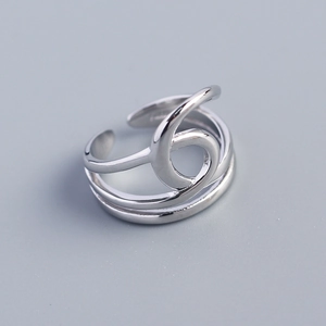 Macro shot of silver S925 multi-layered hollow wire-wrapped open ring with glossy finish