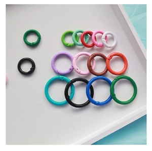 Macro shot of 2.5cm colorful metal spring rings in assorted lacquer finishes on a tray