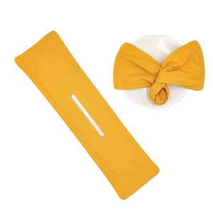 Yellow floral print bun maker tool showing both flat design and finished bow hair styling