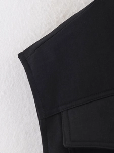 Detailed macro view of black twill fabric texture and durable double-stitched seams
