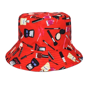 Detailed close-up of a red canvas bucket hat with cosmetic patterns and clean stitching