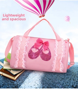 Pink ballet dance barrel bag with sequined shoes, lace straps, and bow for girls