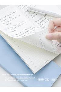 Detail of 100g thick paper in blue daily planner showing grid pages and ink-proof quality