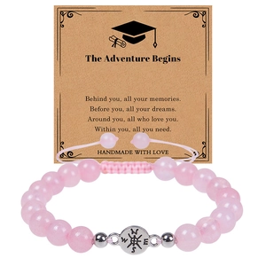 Pink stone beaded bracelet with silver compass charm on The Adventure Begins gift card