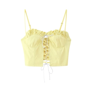 Pale yellow cropped camisole top with thin straps and lace-up front detail