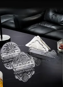 Detailed view of crystal glass napkin holders with various decorative textures and high clarity