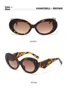 Detail of tortoiseshell oval cat-eye sunglasses with brown gradient lenses and triangle temple