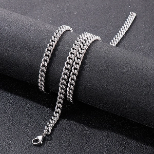 Detail of 7mm silver stainless steel Cuban chain wrapped on black display prop