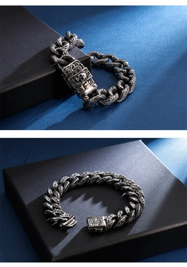 Detail of vintage 304 stainless steel men's bracelet with carved skull buckle