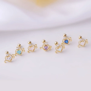 Set of seven gold heart cartilage studs with multicolor cubic zirconia and screw back