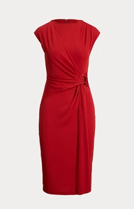Macro view of a red sleeveless midi dress featuring waist pleats and a metal ring buckle