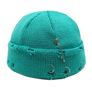 Hip hop mint green distressed knit beanie with metal rings and safety pin accessory