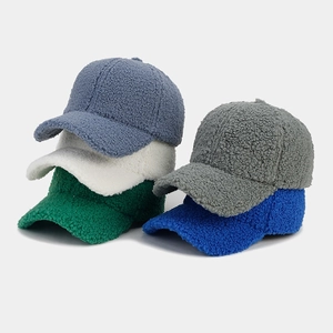 Detailed pile of thick lamb wool baseball caps in gray blue white green and blue colors
